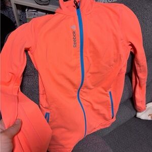 Reebok Women's Long Sleeve Top - Bright Orange with Blue Accents